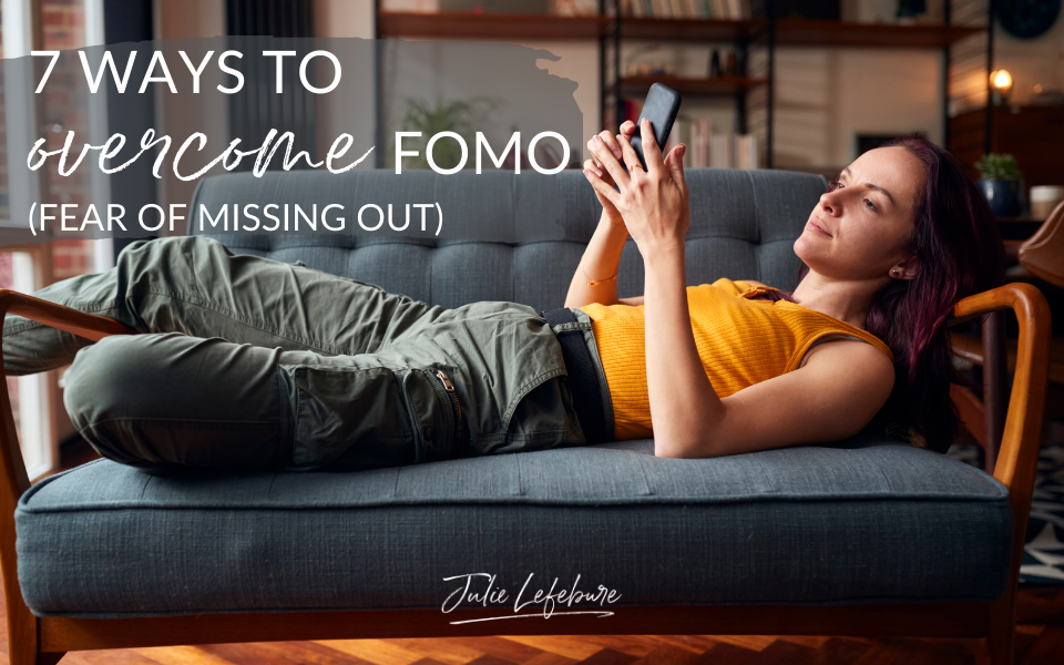 7 Ways to Overcome FOMO | woman lying on couch looking at phone