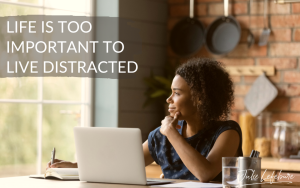 Life Is Too Important to Live Distracted | woman sitting at laptop looking out window