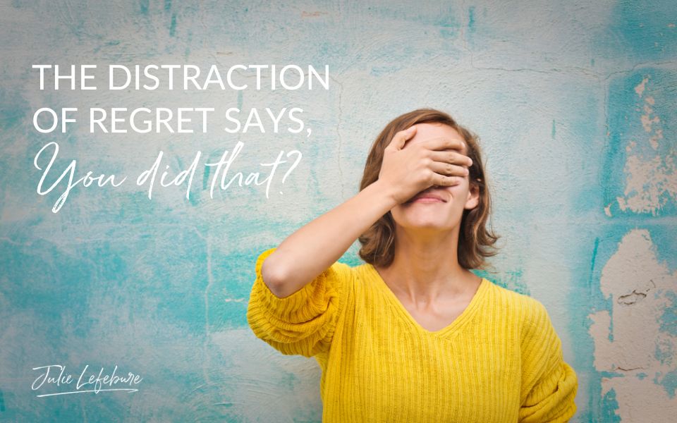 The Distraction of Regret Says, "You Did That?" | Woman in yellow sweater with hand covering her face.