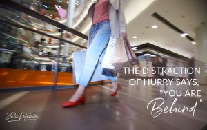 The Distraction of Hurry Says, "You Are Behind" | woman in mall with bags in hand walking fast