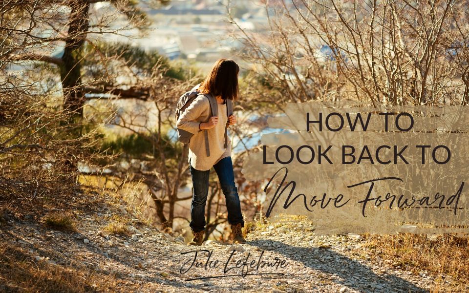 How to Look Back to Move Forward | woman hiking, turned to look behind her