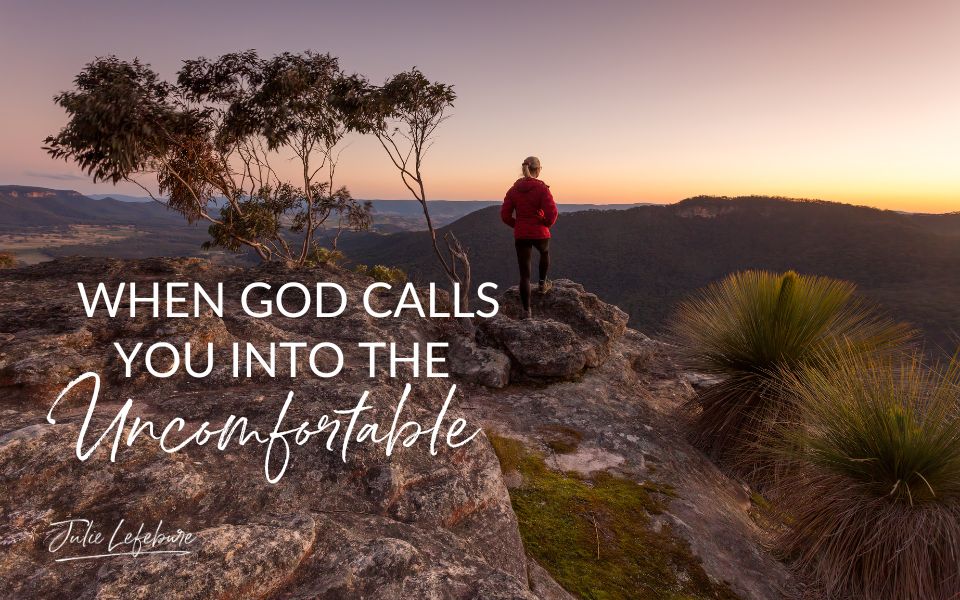 When God Calls You Into the Uncomfortable | woman standing on rocky ledge looking at sunset