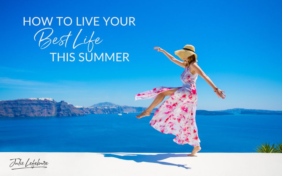 How to Live Your Best Life This Summer | woman in pink flowered dress with hat skipping next to water