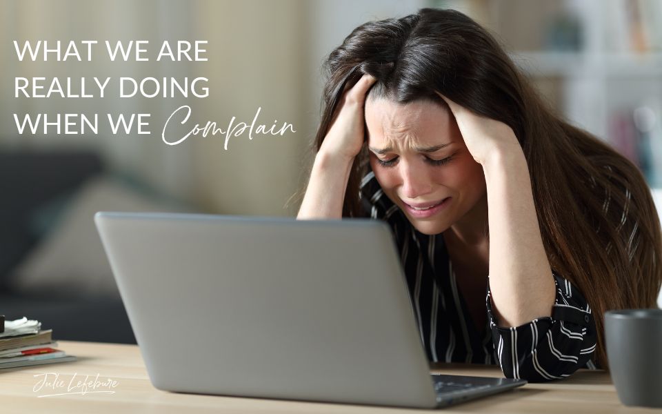 What We Are Really Doing When We Complain | woman with head in hands frustrated facing her laptop
