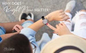 Why Does Right Now Matter? | view from above of a woman in a brimmed hat looking down at her watch