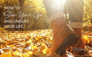 How to Slow Your Go and Unbusy Your Life | women's hiking boots walking on leaf-covered ground with sunbeams