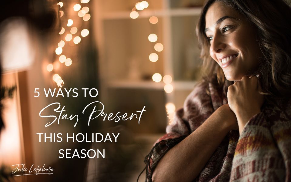 5 Ways to Stay Present This Holiday Season | woman looking at something that is making her smile