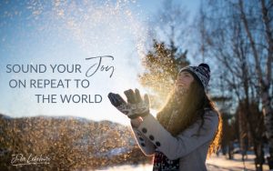 Sound Your Joy on Repeat to the World | woman in winter clothes holding her hands up with snow around her