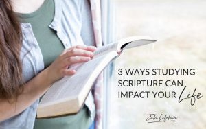 3 Ways Studying Scripture Can Impact Your Life | woman standing next to window with an open Bible in her hands