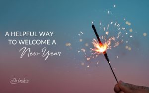 A Helpful Way to Welcome a New Year | a hand holding a sparkler